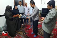 تجلیل از خانواده شهیدان محمد جعفر سعیدی و غلامحسین تیموری