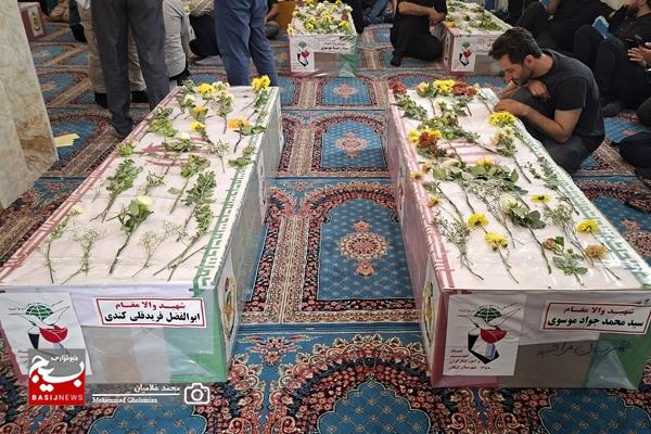وداع با پیکر ۹ شهید پدافند سیراف در کنگان