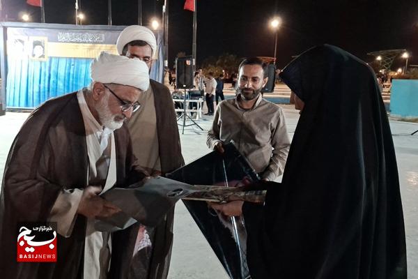 تجلیل از خانواده شهدای مداح و پیرغلامان حسینی کنگان تجلیل از خانواده شهدای مداح و پیرغلامان حسینی کنگان