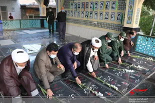 آبروی محله افتخار کوچه ها و گلباران مزار شهدا در امامزاده سید علی اصغر ساوه
