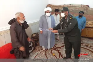 تجلیل از خانواده شهید جاسم بامری در دلگان