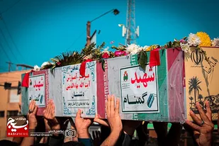 مراسم استقبال از شهید خوشنام هشت سال دفاع مقدس در برازجان برگزار شد