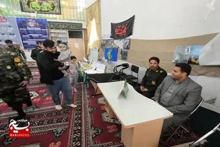 میز خدمت جهادی و دیدار با خانواده شهید شهنوازی در هفته بسیج برگزار شد