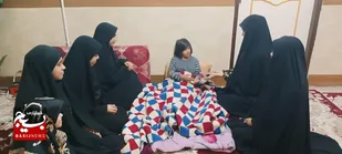 عیادت از کودک دارای بیماری سندروم داون توسط بسیجیان