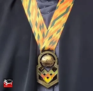 قهرمان بین&zwnj;المللی مدال طلای خود را به همسر شهید مدافع حرم تقدیم کرد