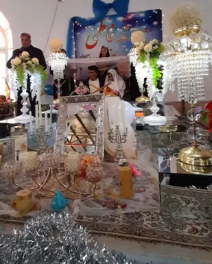 مراسم جشن پیوند فاطمی و ازدواج آسان با حضور ۱۴ زوج جوان راوری برگزار گردید