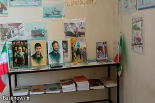 برپایی نمایشگاه عکس شهدا و رزمندگان توسط پایگاه بسیج شهید هنری اسدآباد