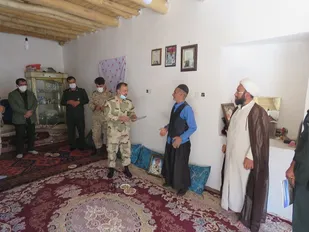 تجلیل از خانواده شهید در دهستان موگویی