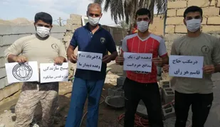 دیواری که به همت جهادی های امیدیه بالا رفت