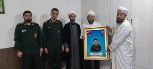 دیدار مسئولان سپاه مراوه&zwnj;تپه با خانواده شهید جنگ رمضان در گلیداغ