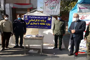 توزیع ماسک توسط بسیجیان اسدآبادی در هفته بسیج
