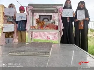 عطر افشانی قبور شهدا در روستای دوله سیب