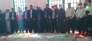 غبار روبی مزار شهدای گمنام شهر رابر
