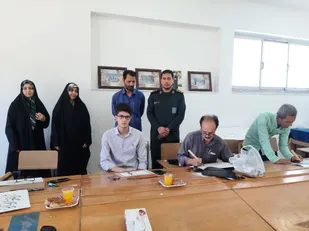 مراسم همنویسی پویش قرآنی در کانون بسیج هنرمندان شهرستان فریمان