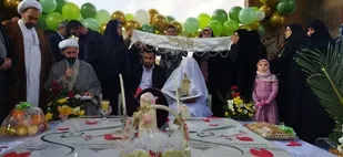 برگزاری  مراسم عقد زوج جوان در کنار گلزار شهدای گمنام ملارد