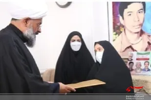 تجلیل از خانواده دو شهید دفاع مقدس در دشتی