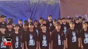 اجرای گروه سرود صبح ظهور زاهدان در مسیر نجف -کربلا