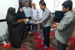 تجلیل از خانواده شهیدان محمد جعفر سعیدی و غلامحسین تیموری