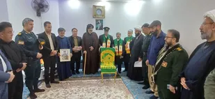 حضور خادمان حرم رضوی و فرماندهی ناحیه در منزل شهید امنیت علی صاکی در هویزه به مناسبت دهه کرامت