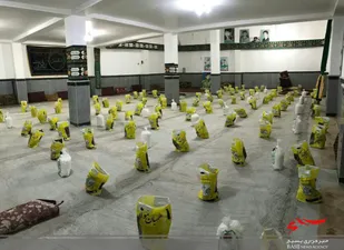 توزیع 100 بسته مواد غذایی در روستای علیگل بجنورد