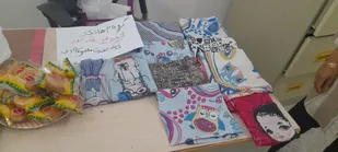 اهدای روسری به دختران نوجوان باهمت گروه جهادی شهید عین الله آور در آغاجاری