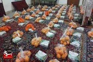 توزیع ۱۵۰ بسته یلدایی به همت بسیج رسانه ملایر در روستای کم&zwnj;برخوردار