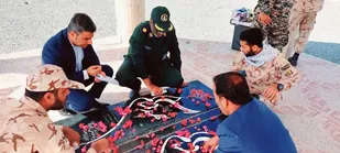 گلزار شهدای بشاگرد غبارروبی و گل افشانی شد