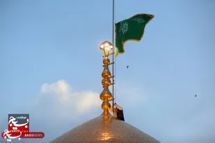 آیین تعویض پرچم گنبد حرم  مطهر حضرت معصومه (س)