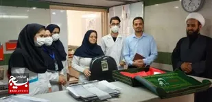 پرچم متبرک گنبد امام حسين علیه السلام فضای بیمارستان امام حسین (ع) گلپایگان را عطرآگین نمود