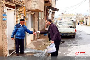 توزیع ماسک توسط بسیجیان اسدآباد