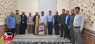 دیدار مسئولین شهر ترکالکی با خانواده شهید کریم رحیمی
