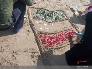 هنرنمایی خانوادگی با ساخت پرچم در ساحل ریشهر