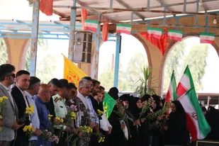 مزار مطهر شهدا در باغملک غبار روبی شد