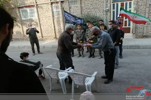 تجلیل بسیجیان همدانی از رزمندگان دفاع مقدس