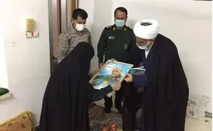 دیدار امام جمعه و فرمانده سپاه کنگان با خانواده شهدا